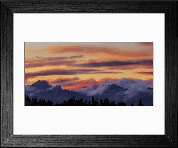 Framed Print : Wide angle panorama silhouette forest and mountain tops in red orange blue clouds gradient sunset Framed Print : Wide angle panorama silhouette forest and mountain tops in red orange blue clouds gradient sunset