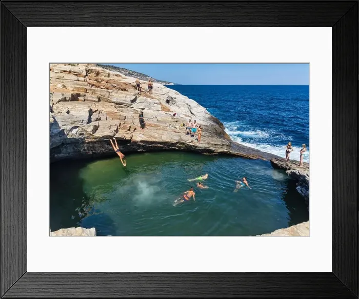 Framed Print : Thassos, Greece - July 20, 2019: Tourists are doing diving in the natural swimming pool Giola in Thassos island, Greece Framed Print : Thassos, Greece - July 20, 2019: Tourists are doing diving in the natural swimming pool Giola in Thassos island, Greece