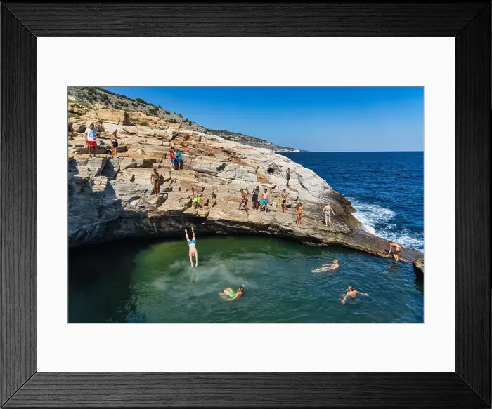 Framed Print : Thassos, Greece - July 20, 2019: Tourists are doing diving in the natural swimming pool Giola in Thassos island, Greece Framed Print : Thassos, Greece - July 20, 2019: Tourists are doing diving in the natural swimming pool Giola in Thassos island, Greece