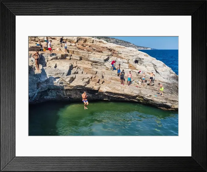 Framed Print : Thassos, Greece - July 20, 2019: Tourists are doing diving in the natural swimming pool Giola in Thassos island, Greece Framed Print : Thassos, Greece - July 20, 2019: Tourists are doing diving in the natural swimming pool Giola in Thassos island, Greece
