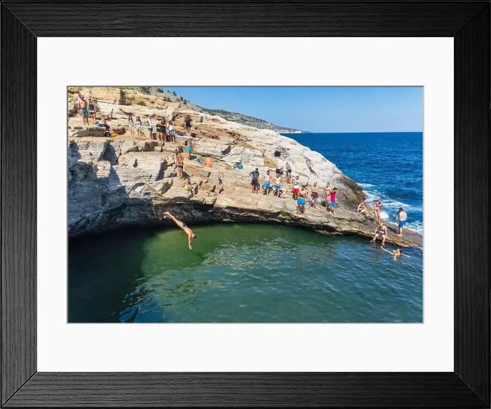 Framed Print : Thassos, Greece - July 20, 2019: Tourists are doing diving in the natural swimming pool Giola in Thassos island, Greece Framed Print : Thassos, Greece - July 20, 2019: Tourists are doing diving in the natural swimming pool Giola in Thassos island, Greece
