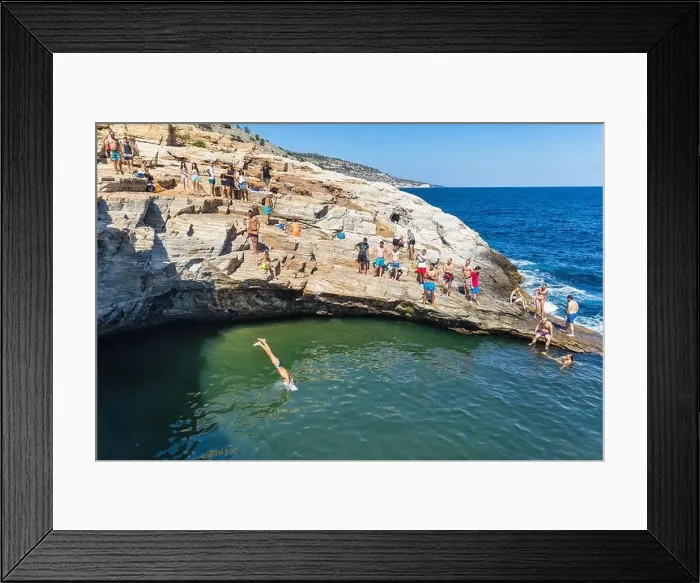 Framed Print : Thassos, Greece - July 20, 2019: Tourists are doing diving in the natural swimming pool Giola in Thassos island, Greece Framed Print : Thassos, Greece - July 20, 2019: Tourists are doing diving in the natural swimming pool Giola in Thassos island, Greece