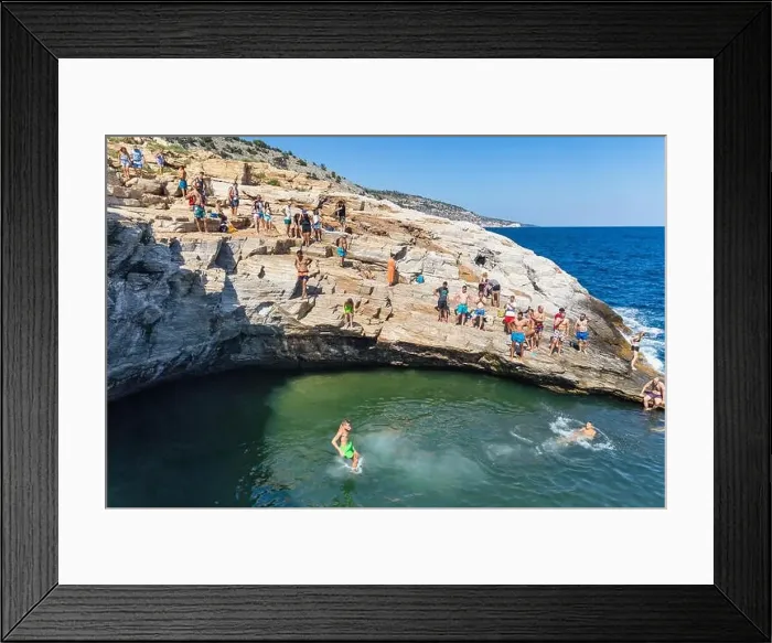 Framed Print : Thassos, Greece - July 20, 2019: Tourists are doing diving in the natural swimming pool Giola in Thassos island, Greece Framed Print : Thassos, Greece - July 20, 2019: Tourists are doing diving in the natural swimming pool Giola in Thassos island, Greece