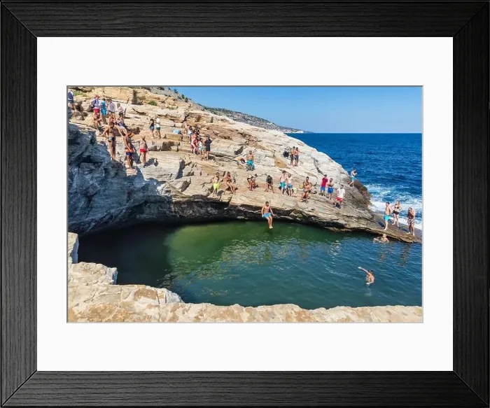 Framed Print : Thassos, Greece - July 20, 2019: Tourists are doing diving in the natural swimming pool Giola in Thassos island, Greece Framed Print : Thassos, Greece - July 20, 2019: Tourists are doing diving in the natural swimming pool Giola in Thassos island, Greece