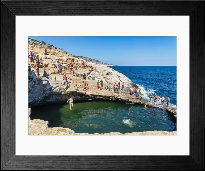 Framed Print : Thassos, Greece - July 20, 2019: Tourists are doing diving in the natural swimming pool Giola in Thassos island, Greece Framed Print : Thassos, Greece - July 20, 2019: Tourists are doing diving in the natural swimming pool Giola in Thassos island, Greece