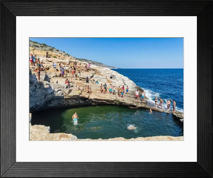 Framed Print : Thassos, Greece - July 20, 2019: Tourists are doing diving in the natural swimming pool Giola in Thassos island, Greece Framed Print : Thassos, Greece - July 20, 2019: Tourists are doing diving in the natural swimming pool Giola in Thassos island, Greece