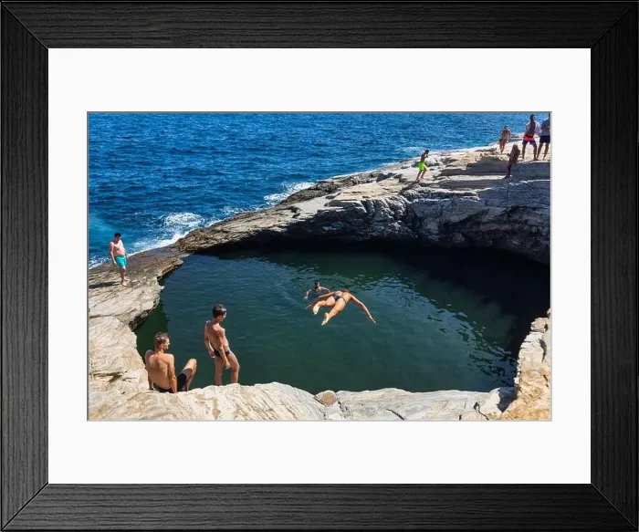 Framed Print : Thassos, Greece - July 20, 2019: Tourists are doing diving in the natural swimming pool Giola in Thassos island, Greece Framed Print : Thassos, Greece - July 20, 2019: Tourists are doing diving in the natural swimming pool Giola in Thassos island, Greece