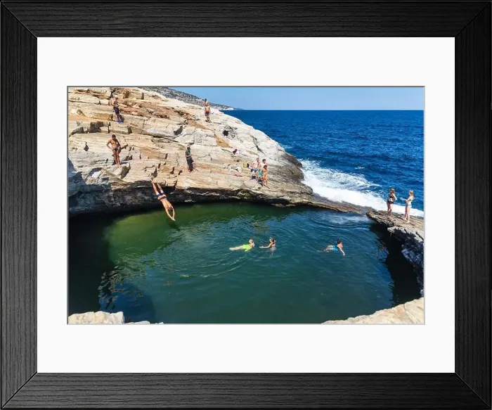 Framed Print : Thassos, Greece - July 20, 2019: Tourists are doing diving in the natural swimming pool Giola in Thassos island, Greece Framed Print : Thassos, Greece - July 20, 2019: Tourists are doing diving in the natural swimming pool Giola in Thassos island, Greece