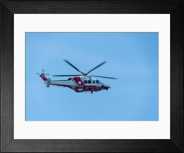 Framed Print : a helicopter flies in the blue sky Framed Print : a helicopter flies in the blue sky