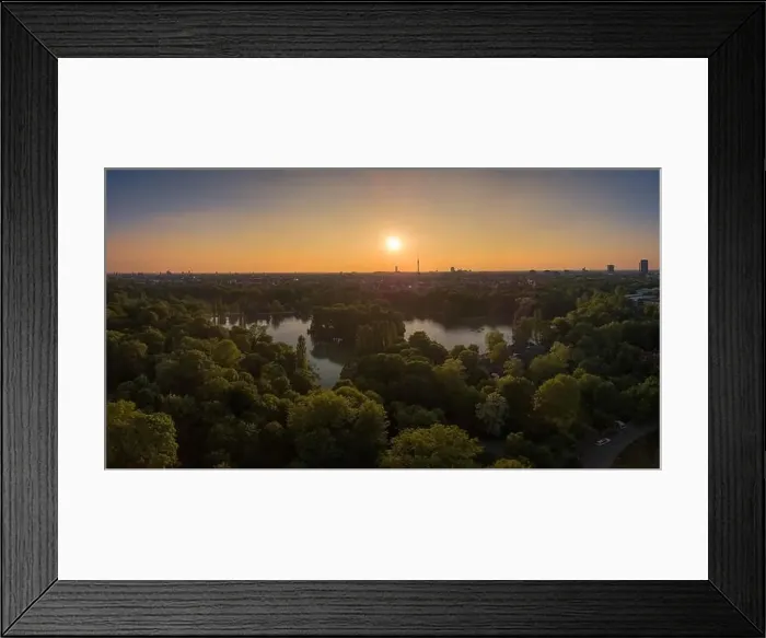 Framed Print : An amazing sunset over a lake, surrounded by trees in Munich, Bavaria Framed Print : An amazing sunset over a lake, surrounded by trees in Munich, Bavaria