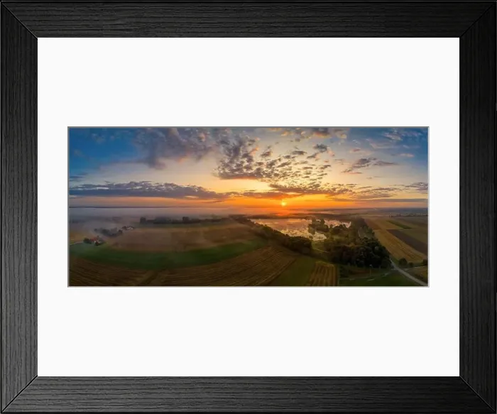 Framed Print : Foggy morning at a lake in Bavaria Germany while the sun is rising. Panoramic aerial made by a drone Framed Print : Foggy morning at a lake in Bavaria Germany while the sun is rising. Panoramic aerial made by a drone