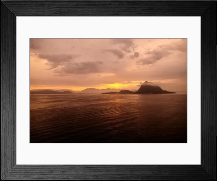 Framed Print : Rock Hessa nearby Alesund / Norway in the ocean with clouds in sunrise Framed Print : Rock Hessa nearby Alesund / Norway in the ocean with clouds in sunrise