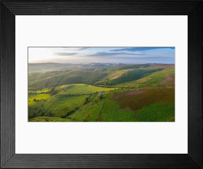 Framed Print : Rolling farming fields in warm sunset light. Panormic aerial view over Shropshire in United Kingdom