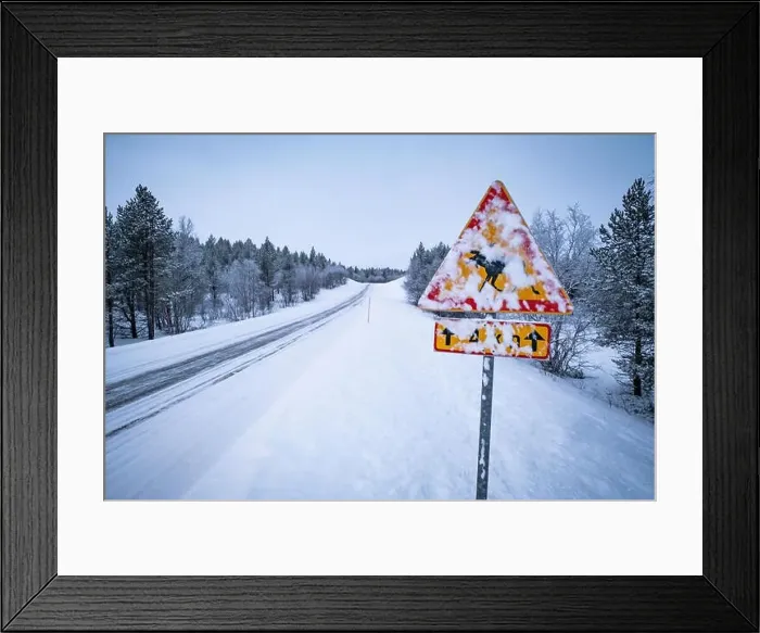 Framed Print : Danger roadsign covered in snow on an empty, snowy road in Lapland Framed Print : Danger roadsign covered in snow on an empty, snowy road in Lapland