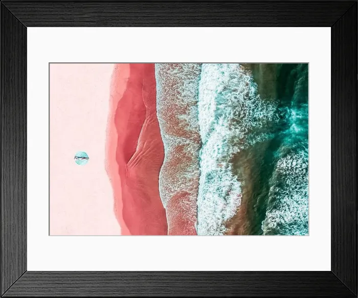 Framed Print : Aerial View Of Woman On Pink Ocean Beach Framed Print : Aerial View Of Woman On Pink Ocean Beach