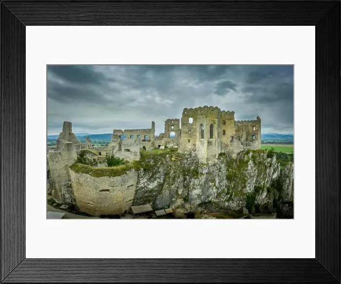 Framed Print : Aerial view of medieval ruined Beckov castle in Slovakia above the Vah river with Gothic chapel and stormy sky Framed Print : Aerial view of medieval ruined Beckov castle in Slovakia above the Vah river with Gothic chapel and stormy sky