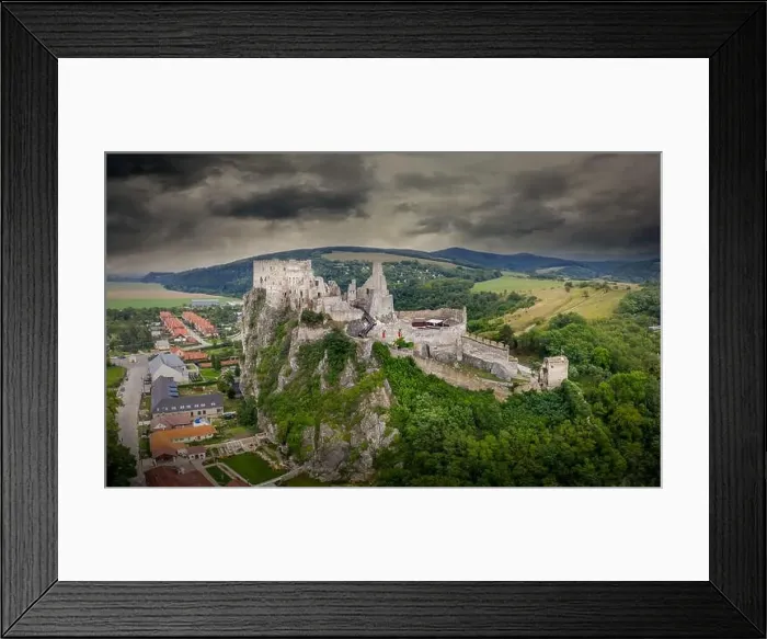 Framed Print : Aerial view of medieval ruined Beckov castle in Slovakia above the Vah river with Gothic chapel and stormy sky Framed Print : Aerial view of medieval ruined Beckov castle in Slovakia above the Vah river with Gothic chapel and stormy sky
