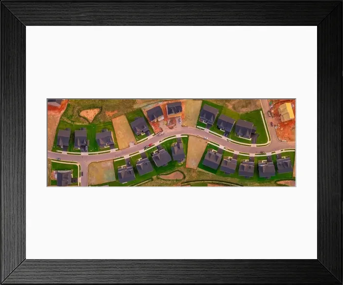 Framed Print : New construction upper middle class single family home neighborhood in America with empty lots Framed Print : New construction upper middle class single family home neighborhood in America with empty lots