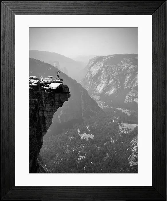 Framed Print : A male hiker taking a photo of the lower Yosemite Valley from the top of half dome Framed Print : A male hiker taking a photo of the lower Yosemite Valley from the top of half dome
