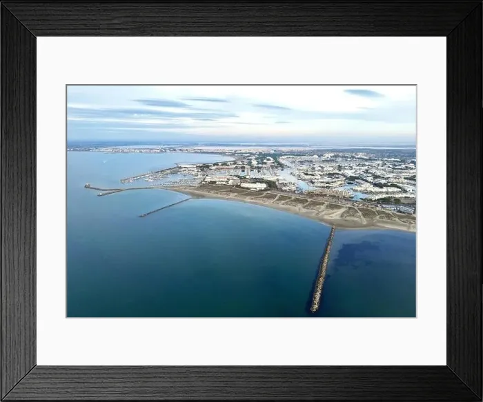 Framed Print : Aerial drone shot of the beach and piers of Port Camargue, Occitanie, France Framed Print : Aerial drone shot of the beach and piers of Port Camargue, Occitanie, France