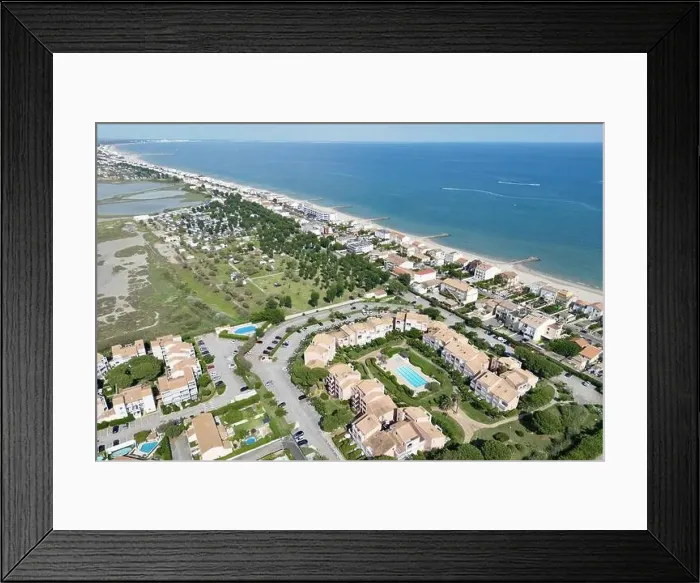 Framed Print : Landscape shot of a summer residence with swimming pool near a camping and the beach in Palavas-les-Flots Framed Print : Landscape shot of a summer residence with swimming pool near a camping and the beach in Palavas-les-Flots