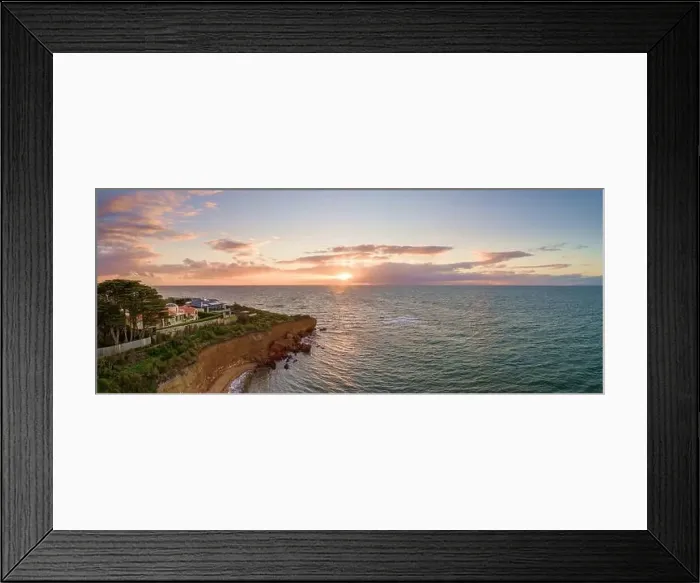 Framed Print : Aerial panoramic seascape of luxury houses on a cliff at sunset Framed Print : Aerial panoramic seascape of luxury houses on a cliff at sunset
