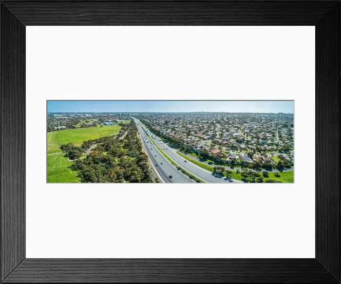 Framed Print : Aerial panorama of highway passing through suburban area on a sunny day in Melbourne, Australia Framed Print : Aerial panorama of highway passing through suburban area on a sunny day in Melbourne, Australia