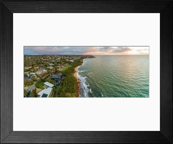 Framed Print : Scenic sunset over ocean coastline with luxury real estate homes and beautiful water at sunset Framed Print : Scenic sunset over ocean coastline with luxury real estate homes and beautiful water at sunset