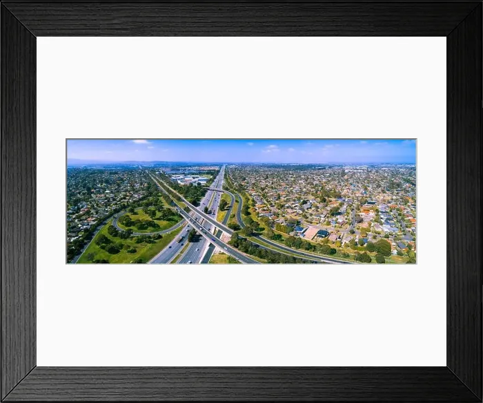 Framed Print : Scenic aerial panorama of highway interchange in greater Melbourne suburbs on sunny day Framed Print : Scenic aerial panorama of highway interchange in greater Melbourne suburbs on sunny day
