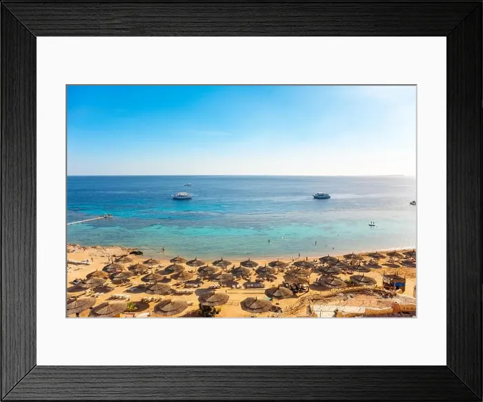 Framed Print : Red sea beach from aerial top view. Tourists relaxing under umbrellas on luxury resort, Egypt Framed Print : Red sea beach from aerial top view. Tourists relaxing under umbrellas on luxury resort, Egypt