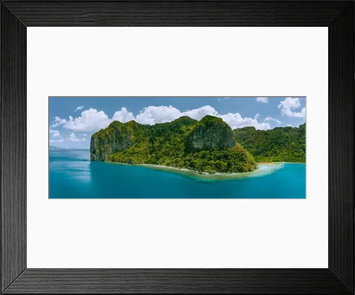 Framed Print : Aerial panoramic drone view of uninhabited tropical island with towering mountains Framed Print : Aerial panoramic drone view of uninhabited tropical island with towering mountains