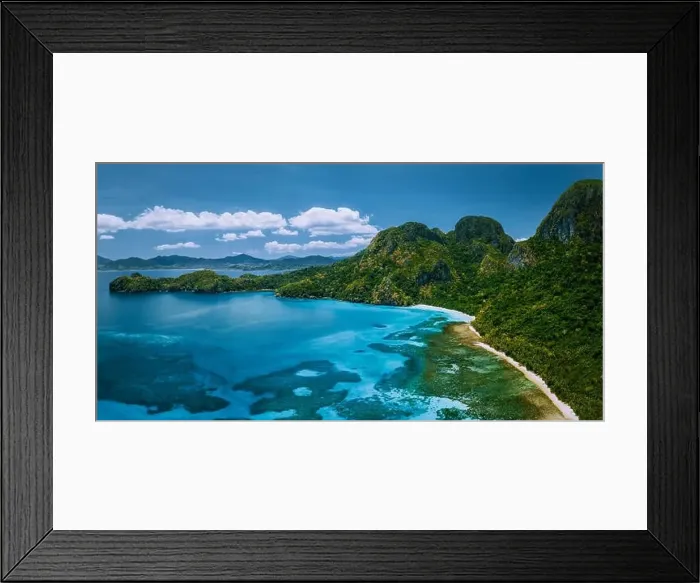 Framed Print : Aerial drone panoramic view of uninhabited tropical island with rugged mountains Framed Print : Aerial drone panoramic view of uninhabited tropical island with rugged mountains
