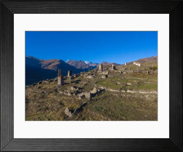 Framed Print : Mountain landscape and medieval architecture of North Ossetia. Shot on a drone Framed Print : Mountain landscape and medieval architecture of North Ossetia. Shot on a drone