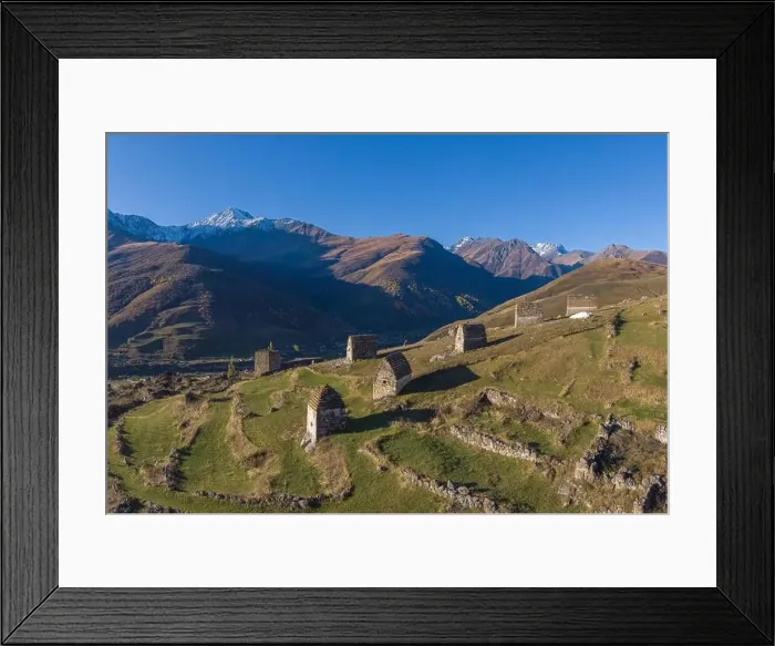 Framed Print : Mountain landscape and medieval architecture of North Ossetia. Shot on a drone Framed Print : Mountain landscape and medieval architecture of North Ossetia. Shot on a drone