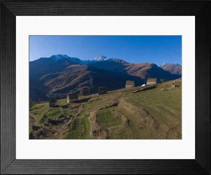 Framed Print : Mountain landscape and medieval architecture of North Ossetia. Shot on a drone Framed Print : Mountain landscape and medieval architecture of North Ossetia. Shot on a drone