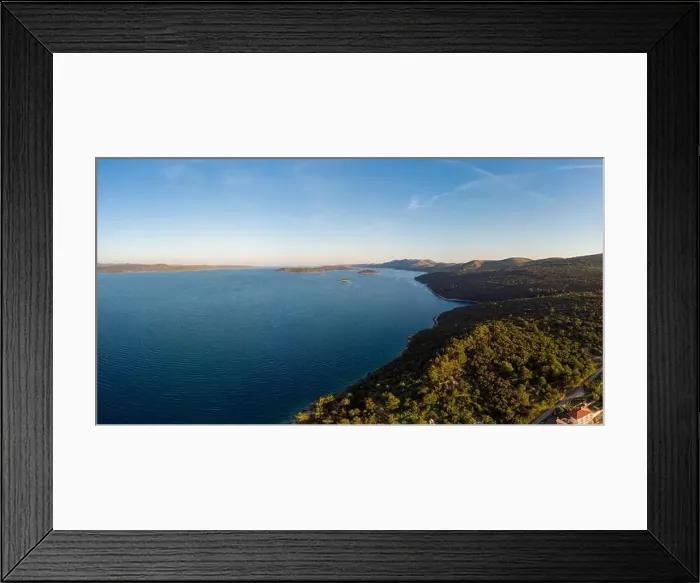 Framed Print : Spectacular aerial landscape with fishing village near peninsula stretching into the sea