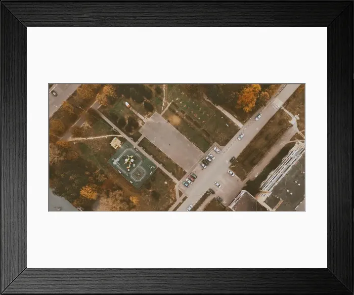 Framed Print : Courtyard of small town with children playground, parking with cars, green lawn and roads. Drone view. Banner background Framed Print : Courtyard of small town with children playground, parking with cars, green lawn and roads. Drone view. Banner background