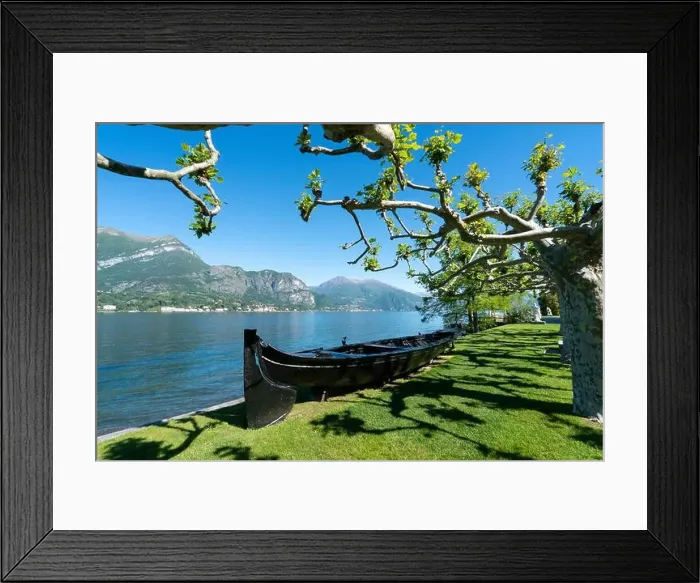 Framed Print : Amazing view of garden with boat in Bellagio - Como lake in Italy Framed Print : Amazing view of garden with boat in Bellagio - Como lake in Italy