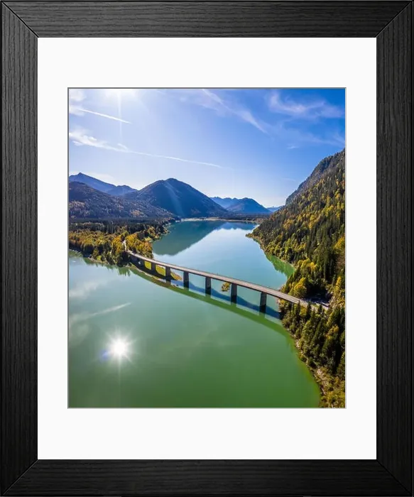 Framed Print : Scenic aerial view of the bridge over Lake Sylvenstein with beautiful reflections Framed Print : Scenic aerial view of the bridge over Lake Sylvenstein with beautiful reflections
