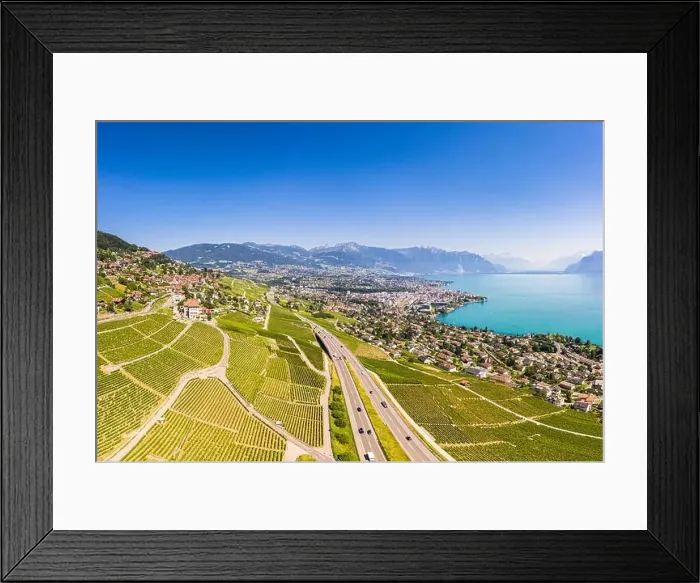 Framed Print : Stunning aerial view of the famous Lavaux vineyard by Vevey and lake Geneva in Canton Vaud in Switzerland Framed Print : Stunning aerial view of the famous Lavaux vineyard by Vevey and lake Geneva in Canton Vaud in Switzerland