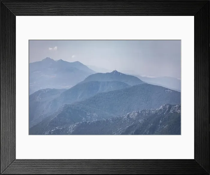 Framed Print : Panorama of beautiful silhouette mountains in blue tones with haze and clouds