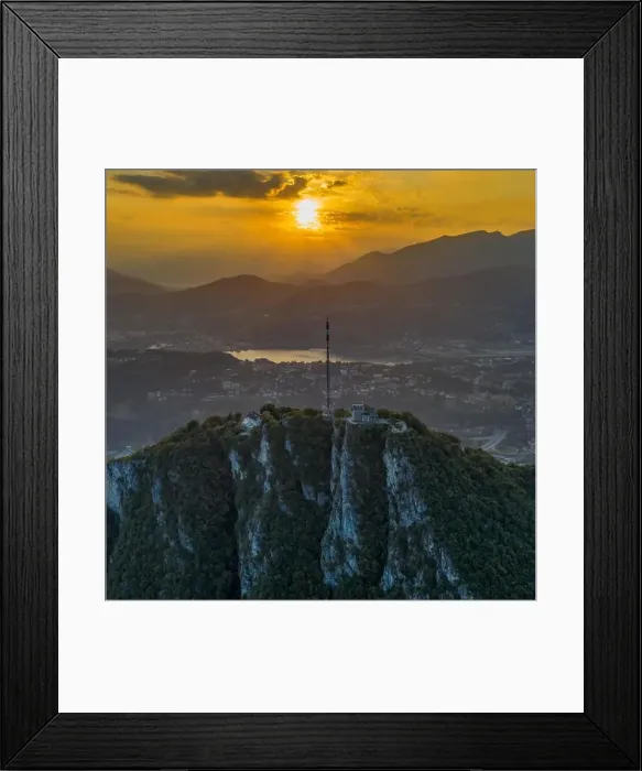 Framed Print : Aerial drone shot view of top of monte salvatore with sunset and Varese village Framed Print : Aerial drone shot view of top of monte salvatore with sunset and Varese village