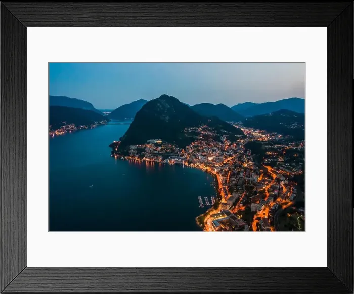 Framed Print : High angle aerial drone night shot of city street lights by lake monte salvatore in Lugano, Switzerland