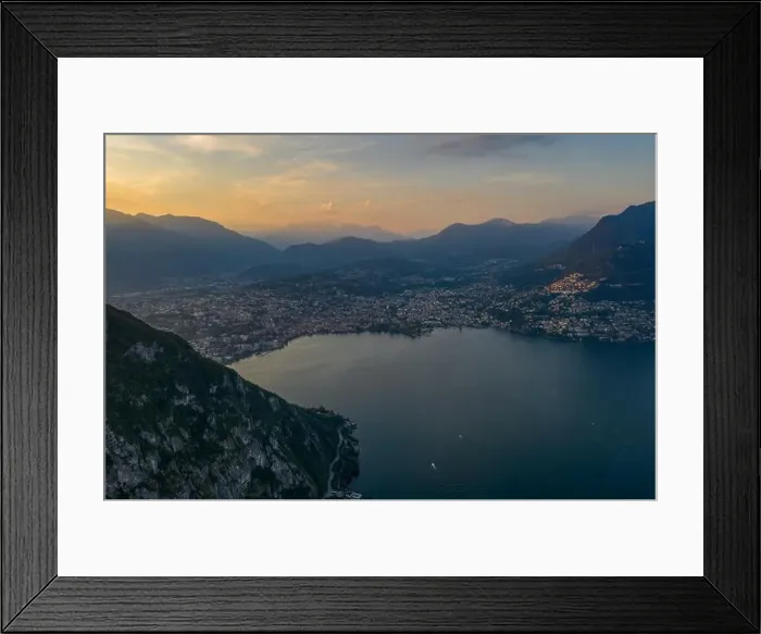 Framed Print : Aerial drone shot sunset view of Lugano city by lake, Monte Bre and Mont Salvatore Framed Print : Aerial drone shot sunset view of Lugano city by lake, Monte Bre and Mont Salvatore