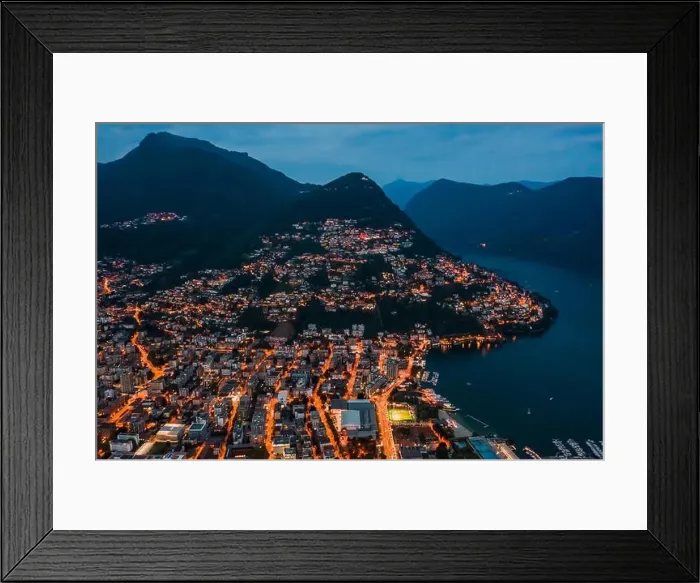 Framed Print : High angle aerial drone night shot of city street lights by lake monte bre in Lugano, Switzerland Framed Print : High angle aerial drone night shot of city street lights by lake monte bre in Lugano, Switzerland