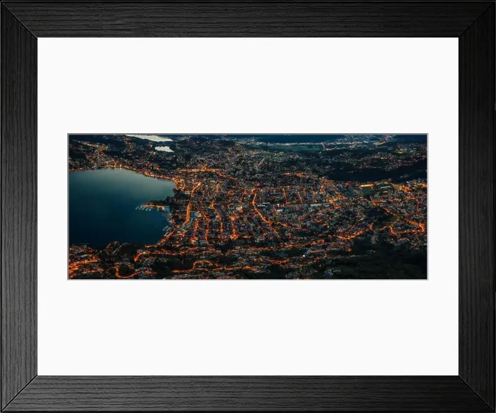 Framed Print : Aerial drone shot panorama view of Lugano by lake after sunset with city lights on in Switzerland