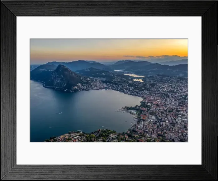 Framed Print : Aerial drone shot view before sunset of Swiss city Lugano and Monte Salvatore by Lago di lugano