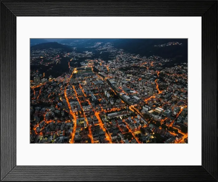 Framed Print : High angle aerial drone night shot of city street lights in Lugano, Switzerland Framed Print : High angle aerial drone night shot of city street lights in Lugano, Switzerland