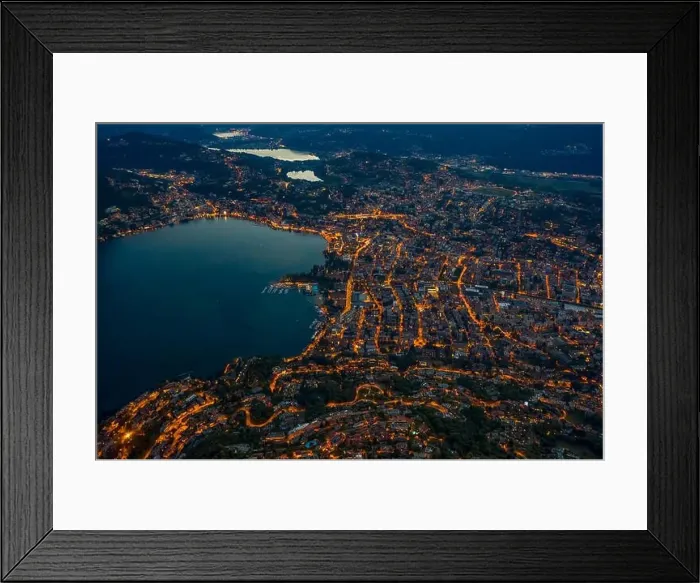 Framed Print : High angle aerial drone shot view Lugano by lake with city street lights after sunset in Switzerland Framed Print : High angle aerial drone shot view Lugano by lake with city street lights after sunset in Switzerland