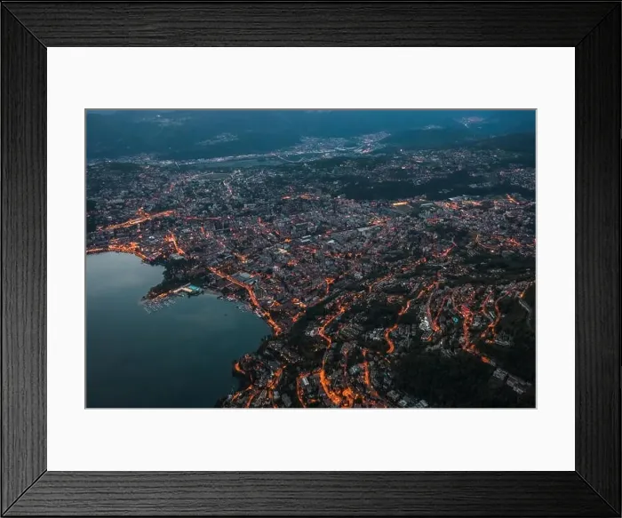Framed Print : High angle aerial drone shot view Lugano by lake with city street lights after sunset in Switzerland Framed Print : High angle aerial drone shot view Lugano by lake with city street lights after sunset in Switzerland